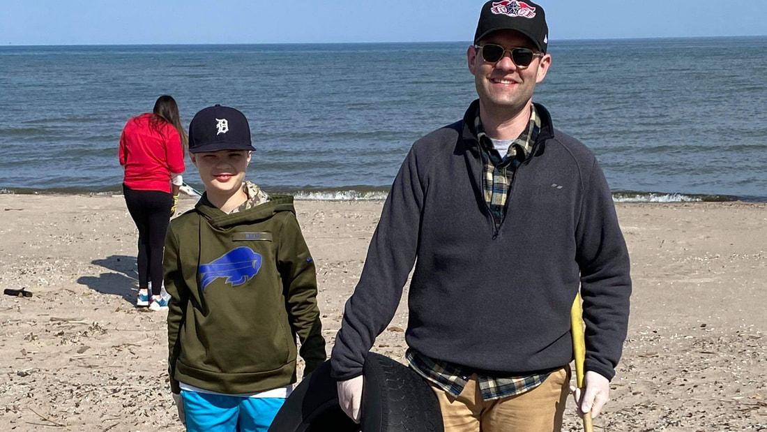 Dave and son at beach clean-up